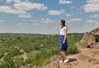 Young beautiful on a rocks with Migeya valley view, Ukraine.