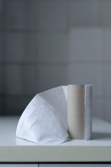 The last sheet of toilet paper on the roll in a bathroom