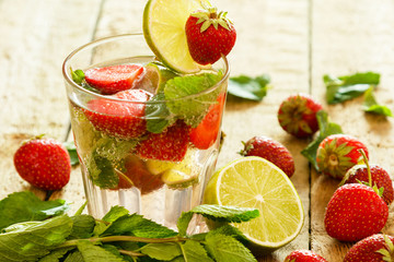 Refreshing drink with strawberry, lime and mint