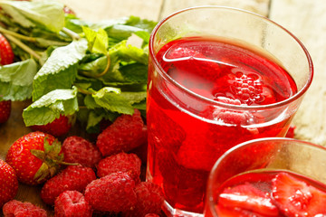 Glasses of refreshing drink with berries