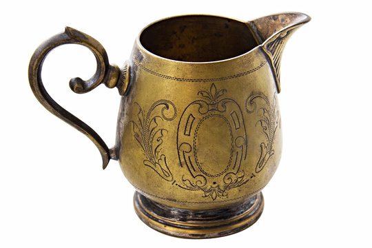 bronze Jug of milk on white background. Creamer argentan isolated.