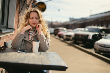 Young girl at a cafe table