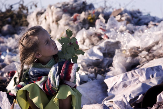 Girl with a rose at the dump