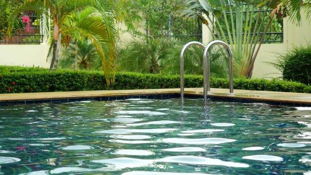 Amazing tropical resort with a swimming pool drowning in greenery and frangipani flowers. Koh Samui. 3840x2160