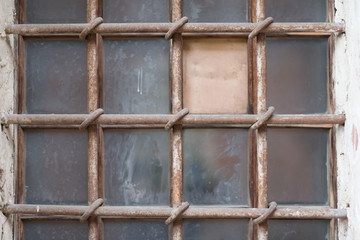 Old window with rusty bars