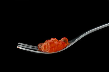 The fork with red caviar