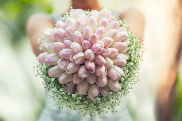 Wedding bouquet. wedding bouquet with tulips in hands of bride.