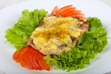 Pork steak with mushroom and cheese