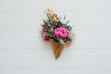 Waffle cone with flowers and decorations.