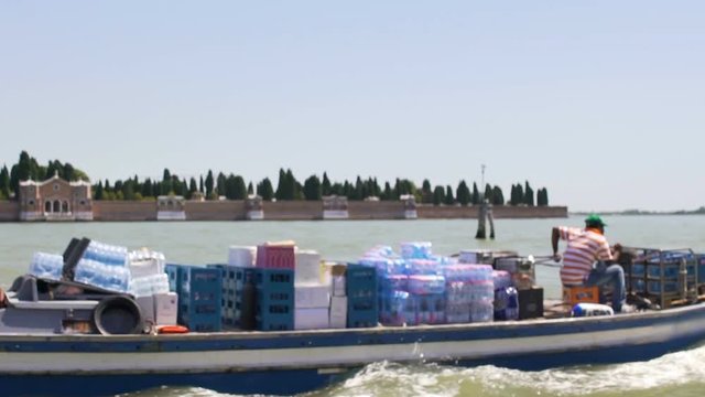 Motorboat carrying humanitarian freight from charity fund, water transportation