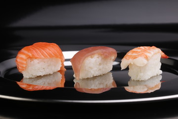 close up of sashimi sushi set with chopsticks and soy - sushi roll with salmon and sushi roll, delicious maki and nigiri