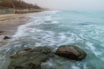 Seashore, sandy beach, blurred waves