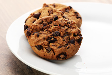 Chocolate cookies on wooden table. Chocolate chip cookies shot