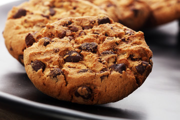 Chocolate cookies on wooden table. Chocolate chip cookies shot