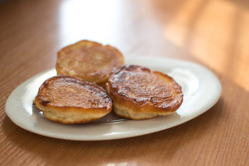 Homemade pancakes on irelke in front of the window