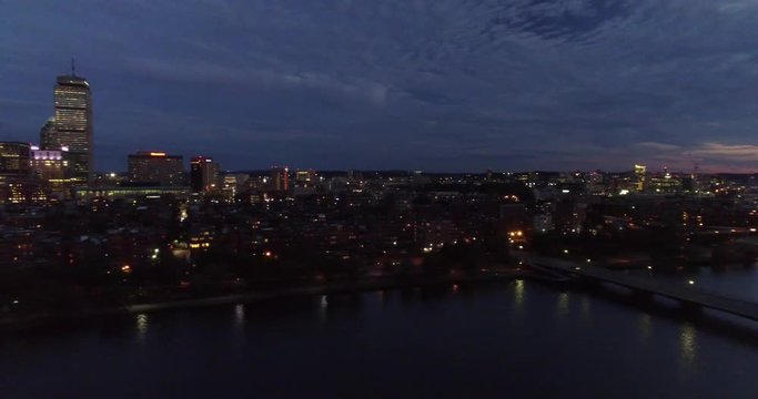 Sliding aerial shot of twilight Boston skyline, Charles River, Back Bay, John Hancock and Prudential tower