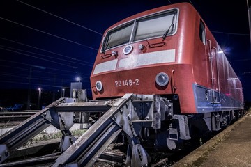 Train at night  at a train station, low angle