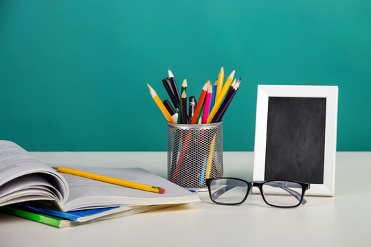 A frame with books on the table.