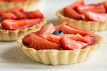 Mini tartlets with fresh strawberries and custard