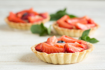 Mini tartlets with fresh strawberries and custard