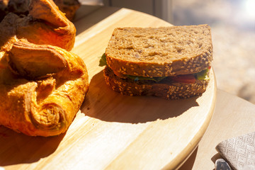 Breakfast food. Homemade breads or bun on wood background, croissant puff cinnamon. Have a nice day