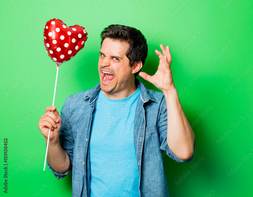 Wall mural surprised man with heart shape