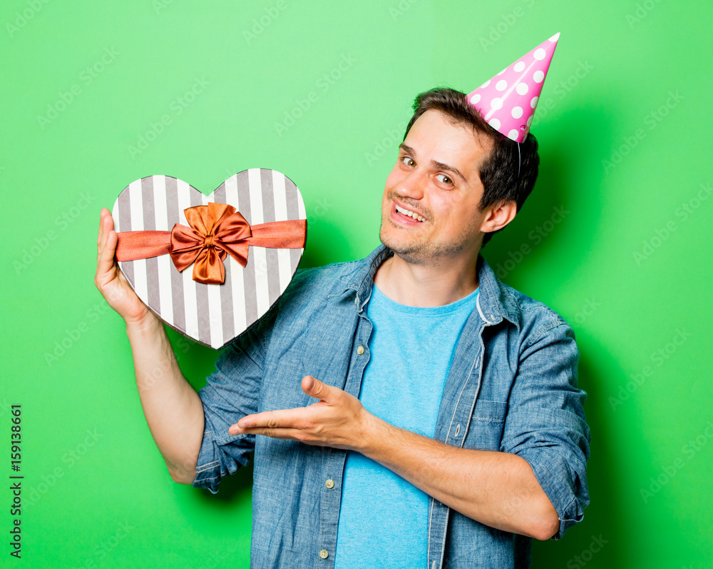 Wall mural man with birthday boy cap with gift