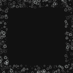 Soap bubbles. Square scattered border with soap bubbles on black background. Vector illustration.