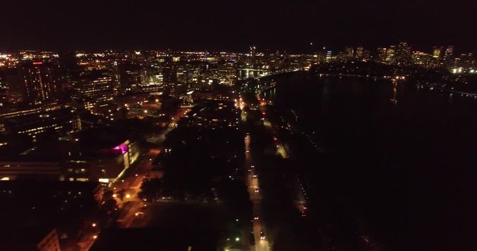 Aerial shot of Cambridge and Boston and Charles river taken at night and revealing Boston skyline