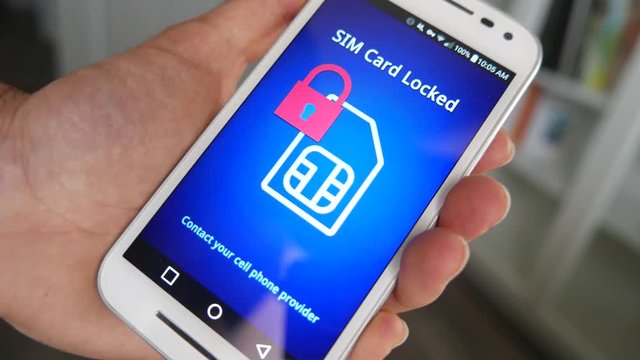 Smartphone displaying a message saying the sim card inserted is blocked and not working.