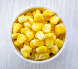 corn in a bowl on wood