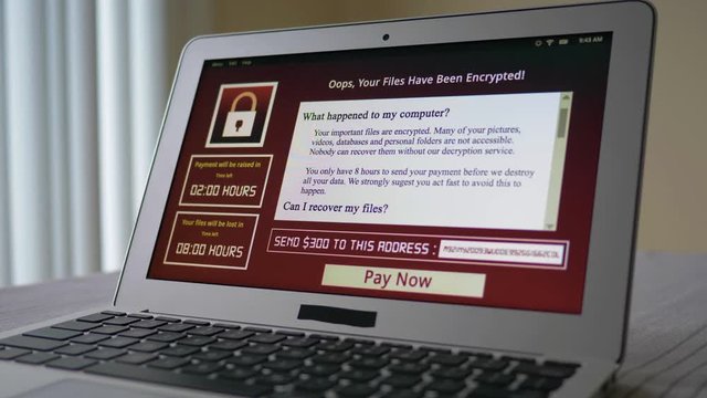 Laptop computer being infected by a ransomware virus that is asking for money to retrieve the encrypted files.