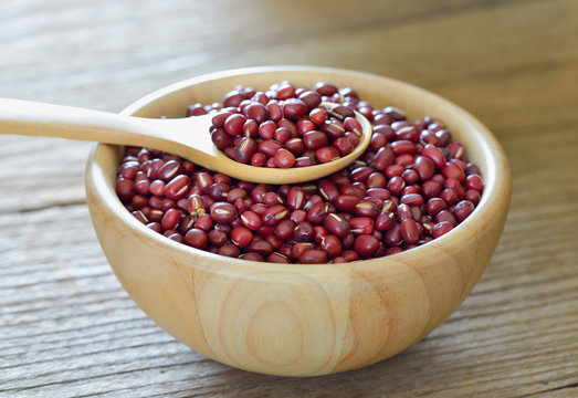adzuki beans in wood spoon on white background