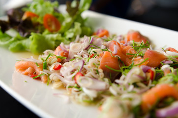close up salmon slices salad spicy