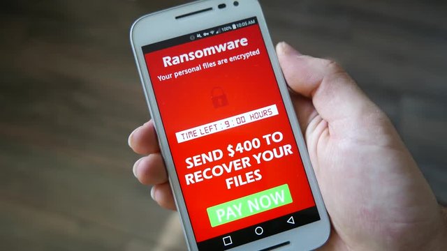 Smartphone being infected by a ransomware virus that is asking for money to retrieve the encrypted files.