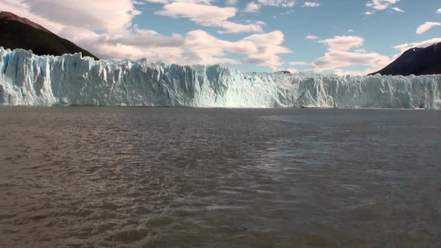 Snowy mountains panorama icebergs on background of clouds in Antarctica. Scenic peaks and ridges. Amazing nature. Travel and tourism in world of wildlife.