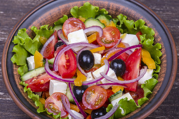 Fresh vegetable greek salad on the table