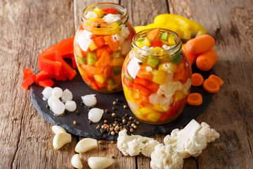 Italian Giardiniera salad of pickled vegetables close-up. horizontal