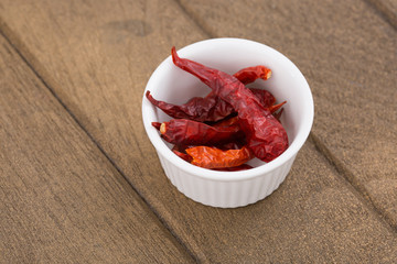 Dried red chilli on wood table