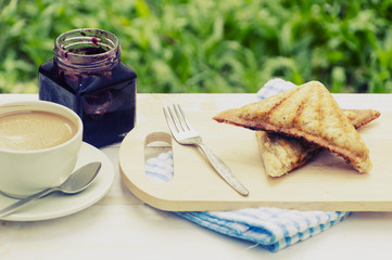 Sandwich with tuna spread and coffee on white wooden table. Selective focus and copy space,Vintage style.