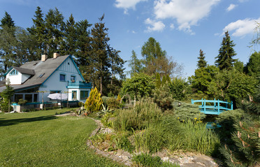 Fototapeta na wymiar Beautiful rural house in spring garden