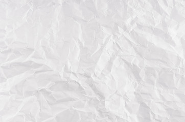 Crumpled white paper texture.