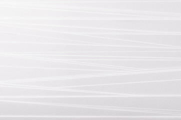 Striped soft white abstract texture background with gradient inclined strips.