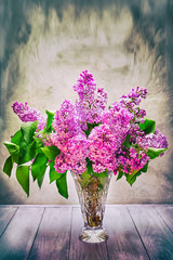 still life bouquet of lilac flowers on the table