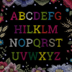 Traditional folk fashionable stylish floral embroidery stitch on a black background. Font, alphabet, sketch for print on clothes, vector
