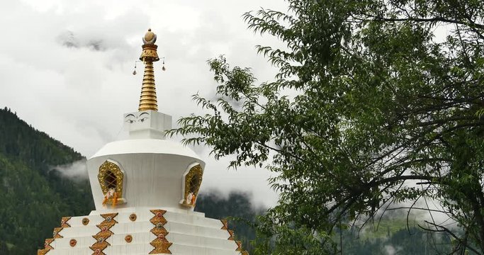 4k tibet buddhist white stupa,cloud cover mountain.