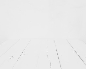 Empty white table on white blurred background wall