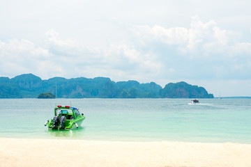 Fototapeta premium police boat with Rairay beach Krabi, Thailand