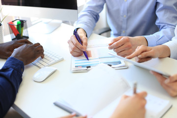 Business adviser analyzing financial figures denoting the progress in the work of the company.