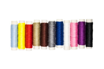 Colored thread coils on white background